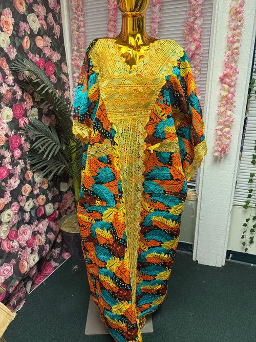 Adejoke dress is made with 100% cotton Ankara fabrics, customized with trimmings and embellished with rhinestones stones.